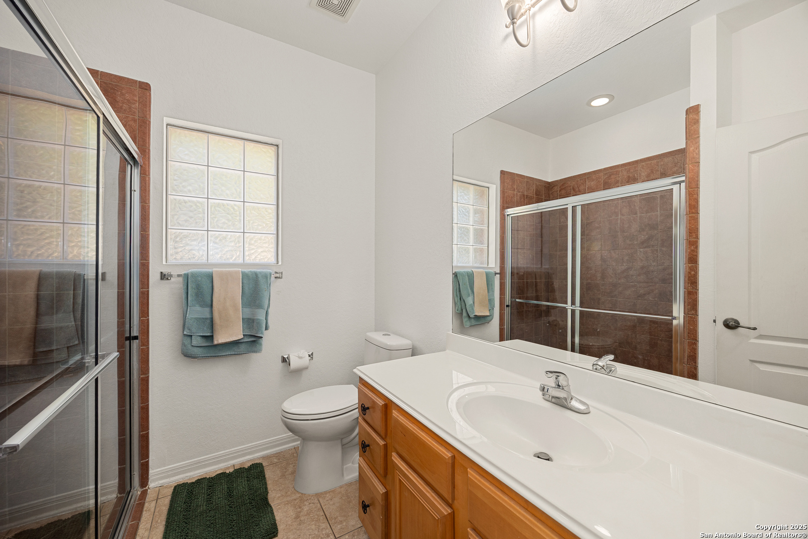 166 Bridle Path Spring Branch, TX 78070 - Photo 15 of 48 a bathroom with a sink toilet and shower
