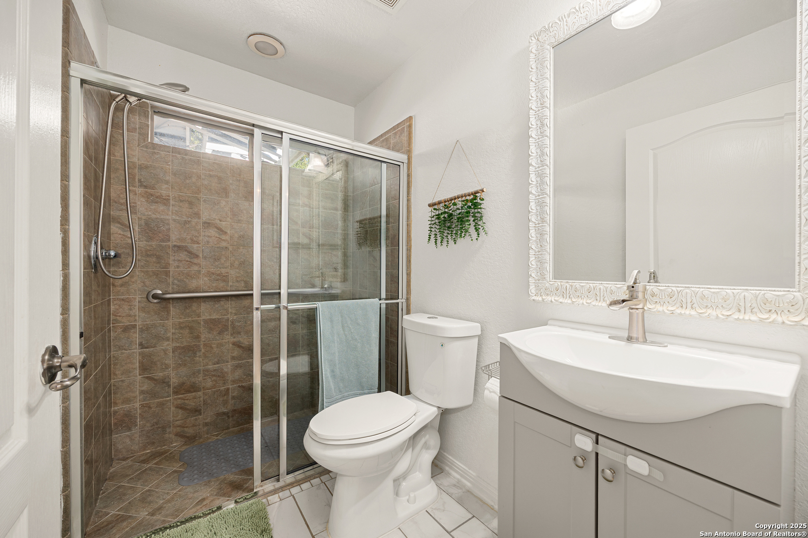 166 Bridle Path Spring Branch, TX 78070 - Photo 18 of 48 a bathroom with a sink toilet and shower