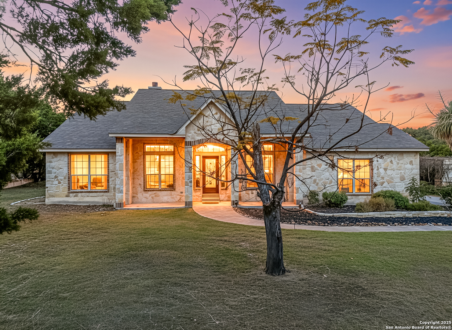 166 Bridle Path Spring Branch, TX 78070 - Photo 2 of 48 a view of a house with a yard