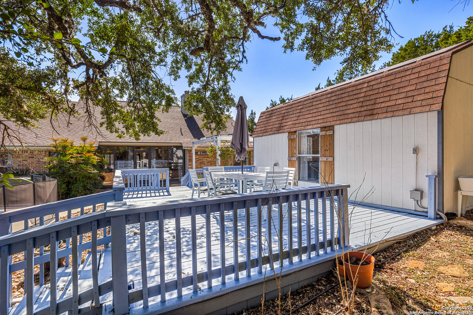 166 Bridle Path Spring Branch, TX 78070 - Photo 30 of 48 a view of a house with a deck