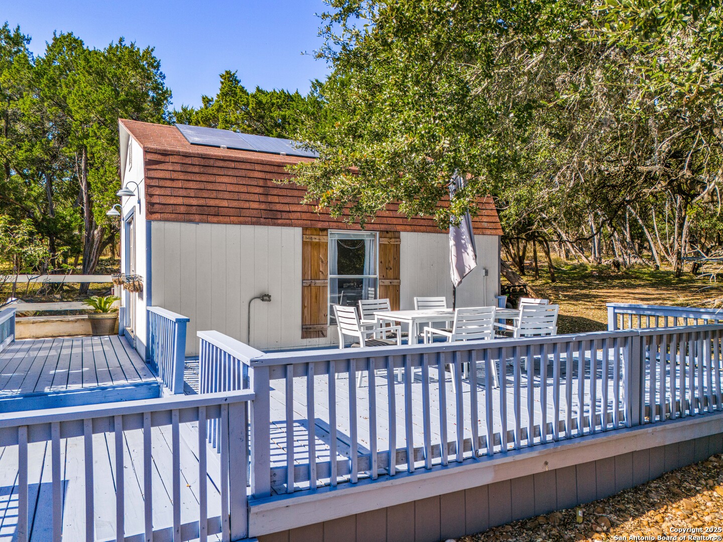 166 Bridle Path Spring Branch, TX 78070 - Photo 31 of 48 a view of a balcony with wooden floor and fence