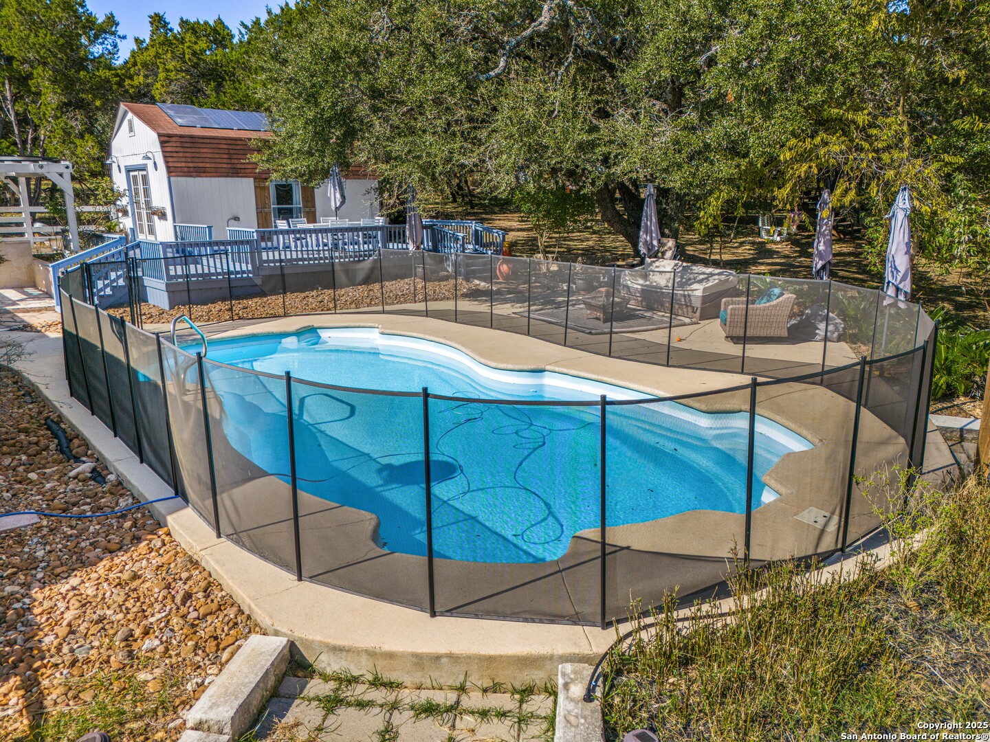 166 Bridle Path Spring Branch, TX 78070 - Photo 33 of 48 a view of a swimming pool with a patio