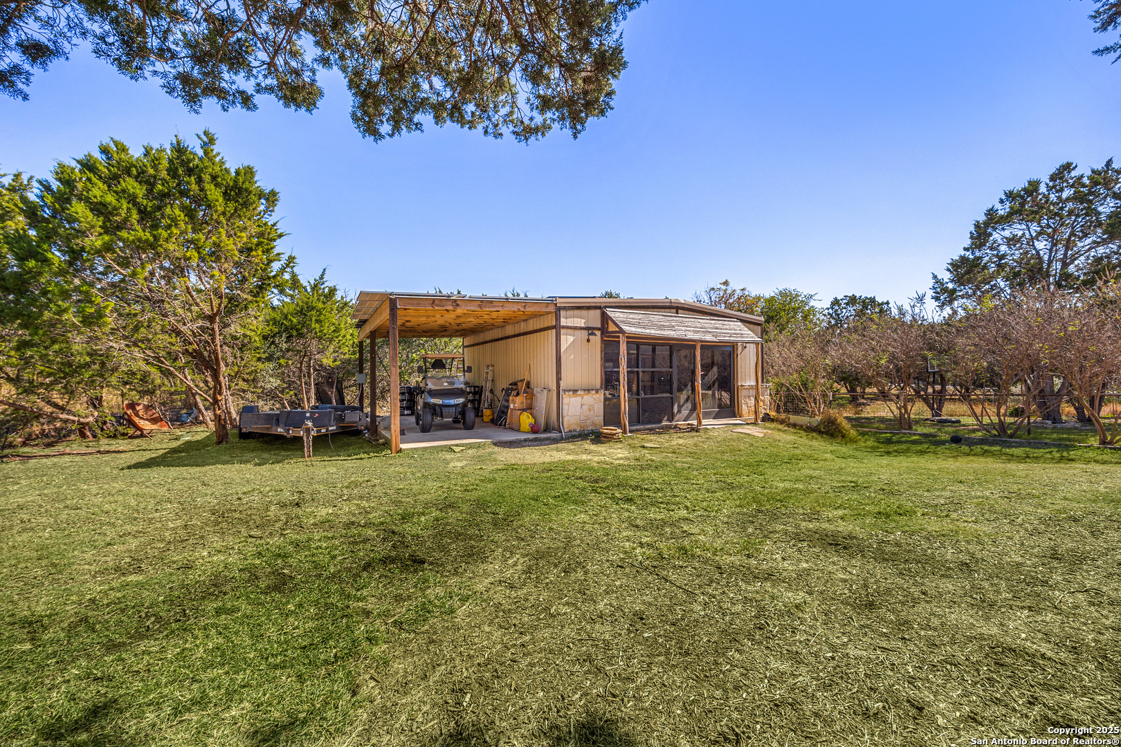166 Bridle Path Spring Branch, TX 78070 - Photo 34 of 48 a view of a big yard with a house