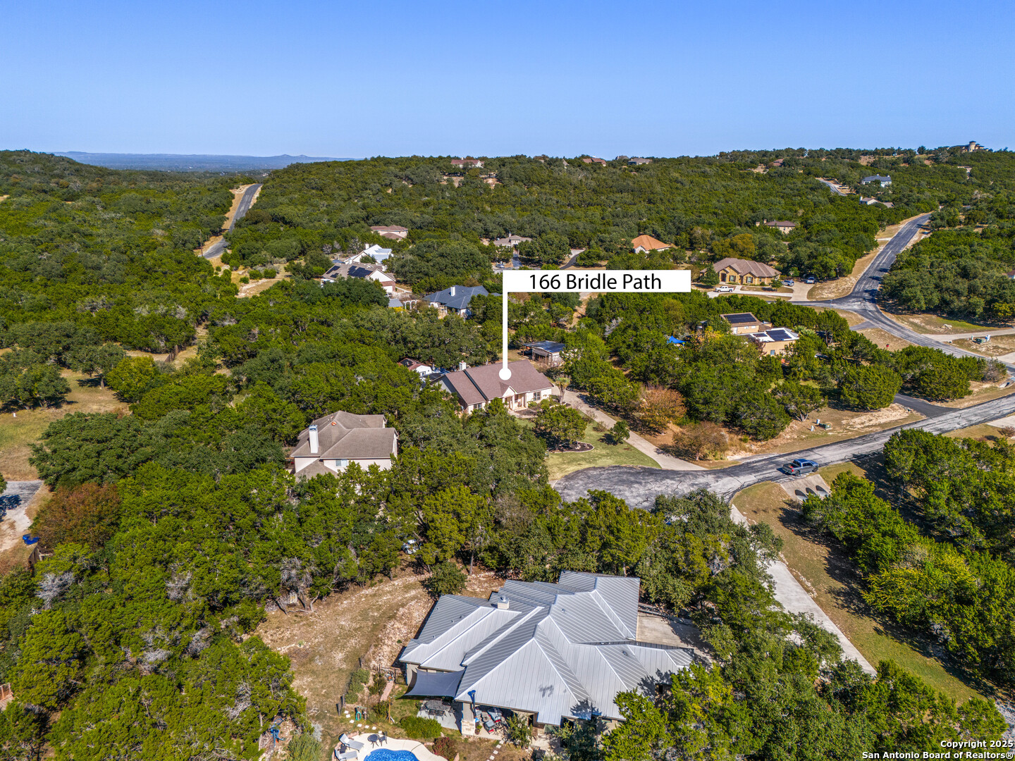 166 Bridle Path Spring Branch, TX 78070 - Photo 46 of 48 a view of a city with mountains in the background