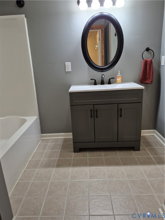 15731 Cooks Mill Road Lanexa, VA 23089 - Photo 10 of 14 Bathroom featuring a gray vanity with a white coun