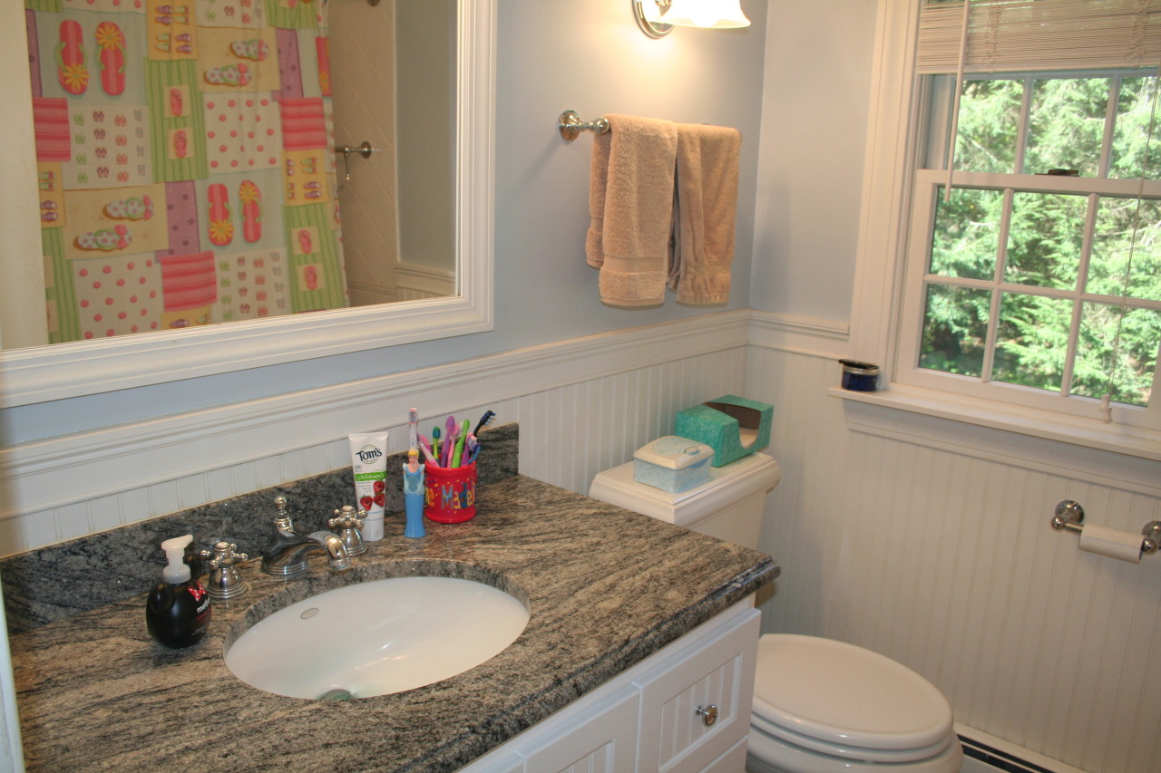 71 Silver Ridge Road New Canaan, CT 06840 - Photo 17 of 29 a bathroom with a granite countertop toilet sink and mirror