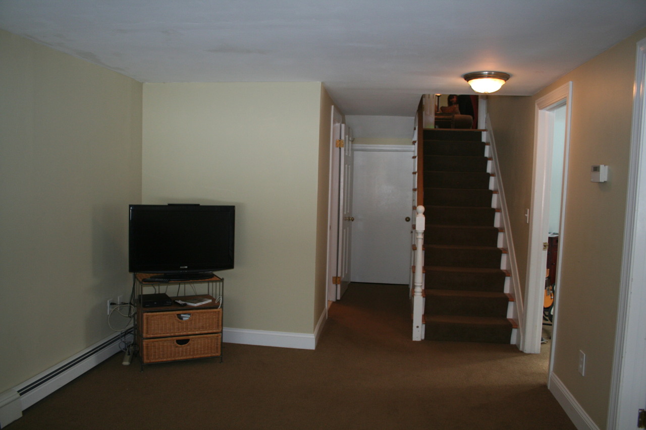 71 Silver Ridge Road New Canaan, CT 06840 - Photo 21 of 29 an empty room with furniture and flat screen tv