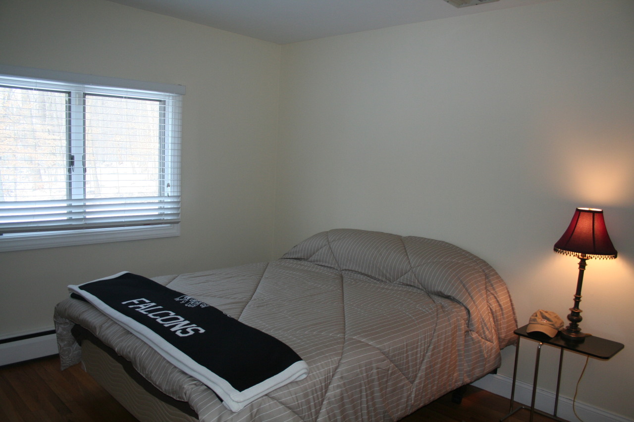71 Silver Ridge Road New Canaan, CT 06840 - Photo 24 of 29 a bedroom with a bed and a window