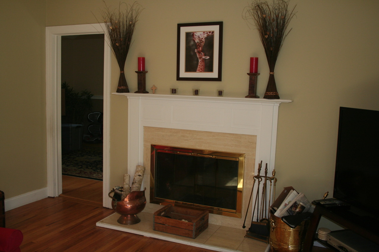 71 Silver Ridge Road New Canaan, CT 06840 - Photo 5 of 29 a living room with a fireplace and a flat screen tv