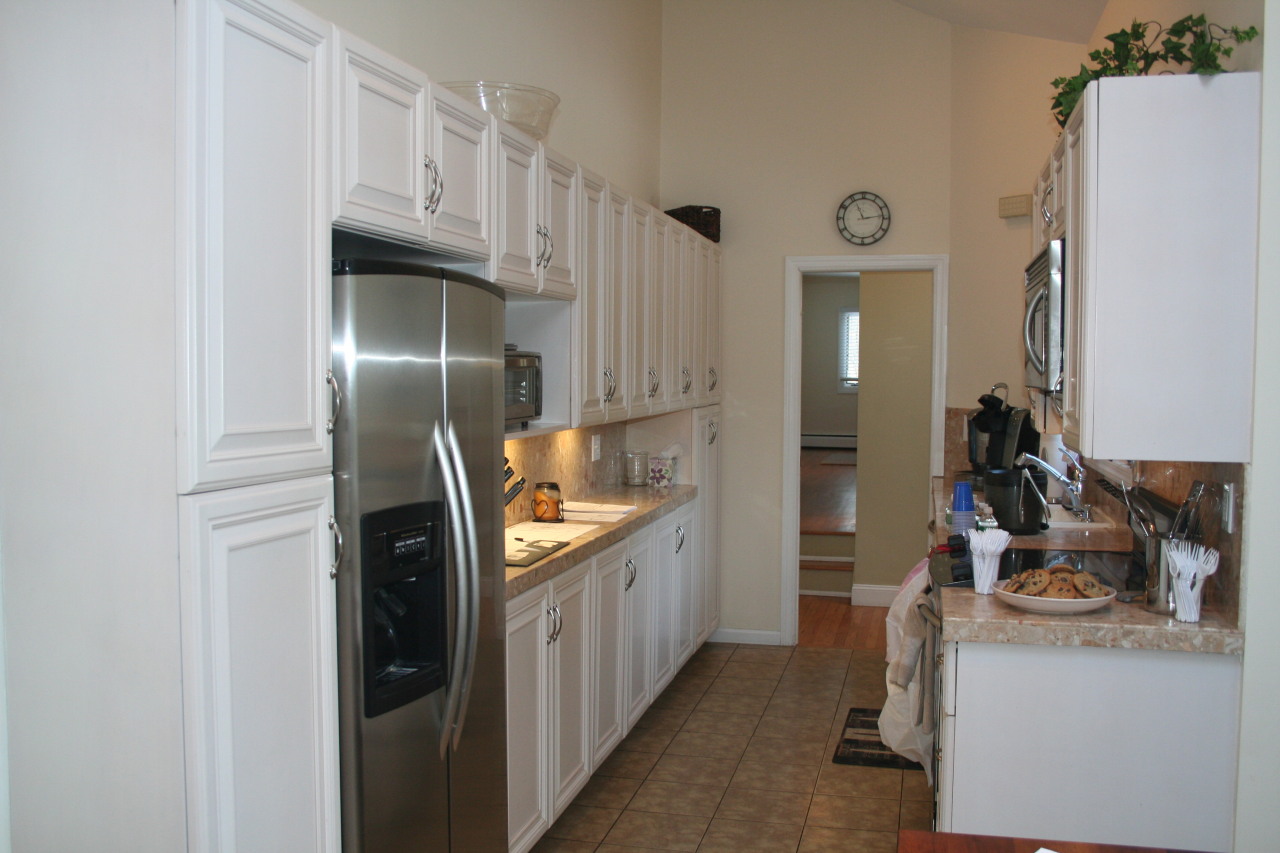 71 Silver Ridge Road New Canaan, CT 06840 - Photo 6 of 29 a kitchen with cabinets and stainless steel appliances