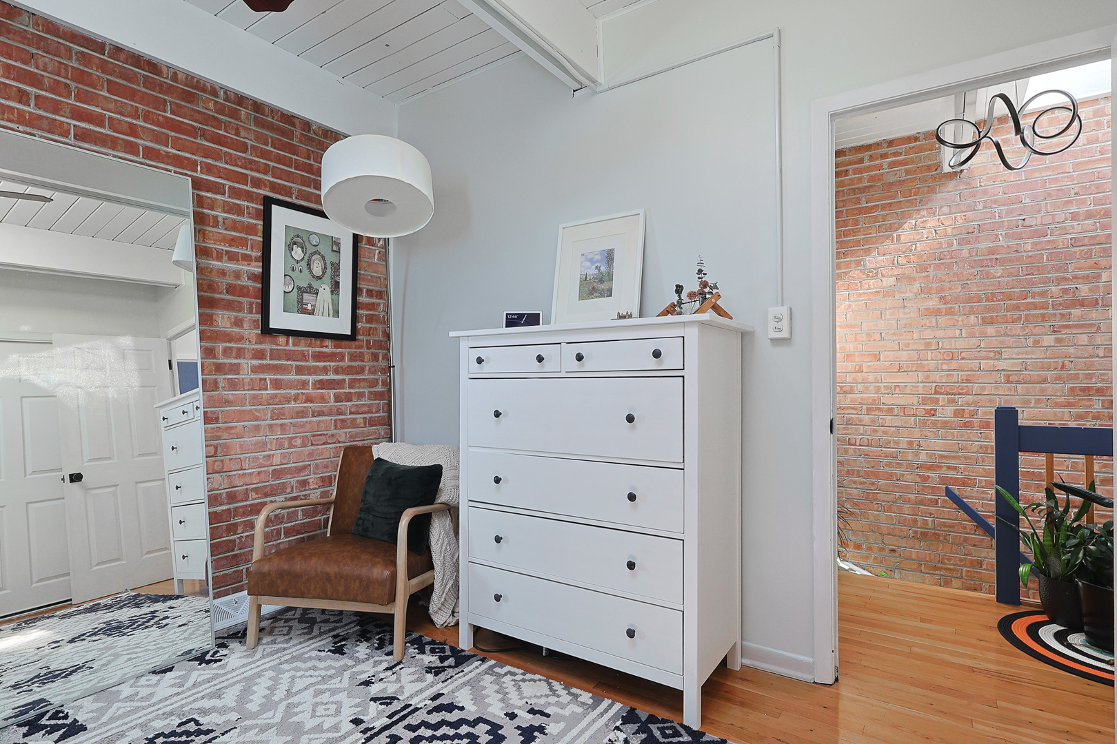 1630 North Sedgwick Street, Unit 2 Chicago, IL 60614 - Photo 16 of 28 a view of a dresser and chair in a room