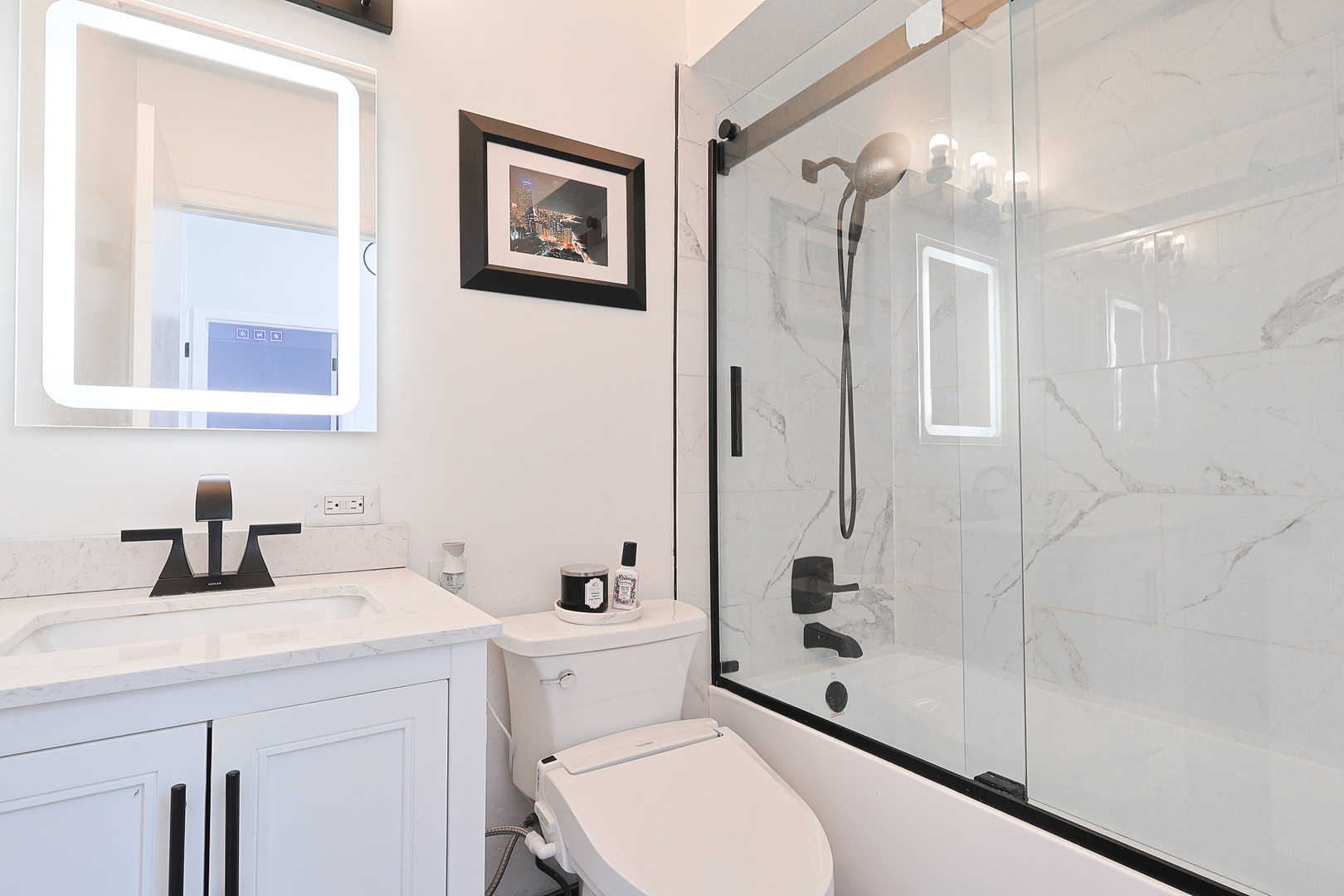 1630 North Sedgwick Street, Unit 2 Chicago, IL 60614 - Photo 17 of 28 a bathroom with a sink a toilet and shower