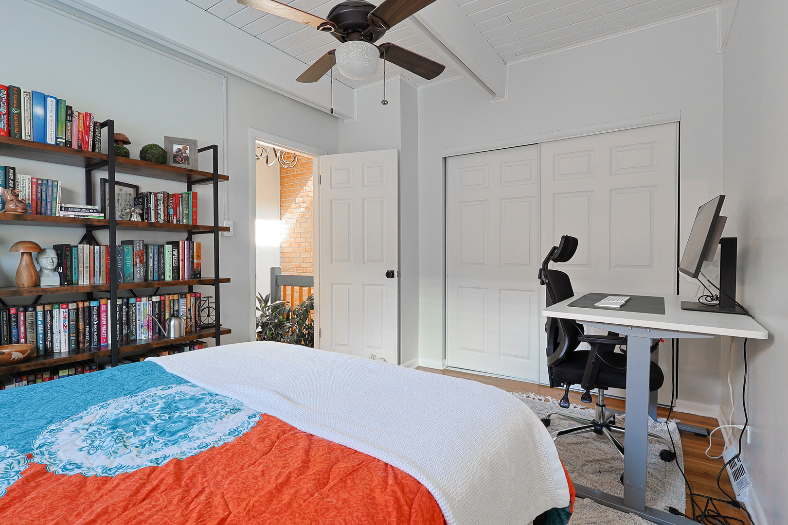 1630 North Sedgwick Street, Unit 2 Chicago, IL 60614 - Photo 19 of 28 a bedroom that has a bed and a bookshelf