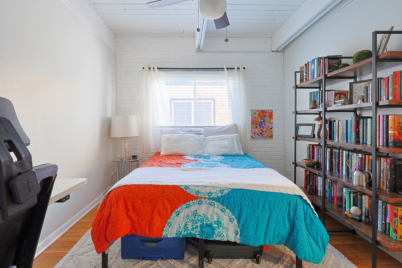 1630 North Sedgwick Street, Unit 2 Chicago, IL 60614 - Photo 20 of 28 a bedroom with a bed and a book shelf