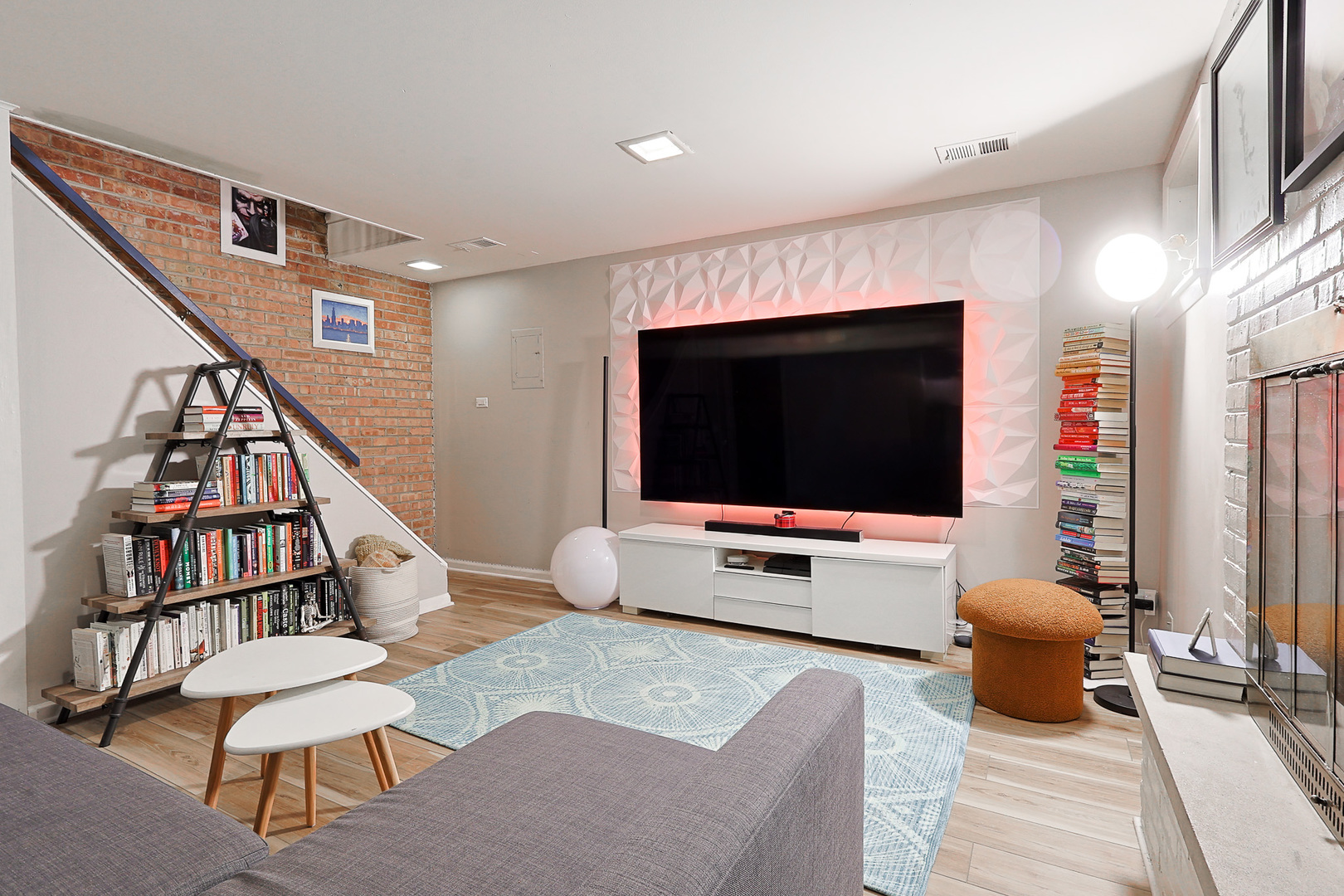1630 North Sedgwick Street, Unit 2 Chicago, IL 60614 - Photo 25 of 28 a living room with furniture and a flat screen tv