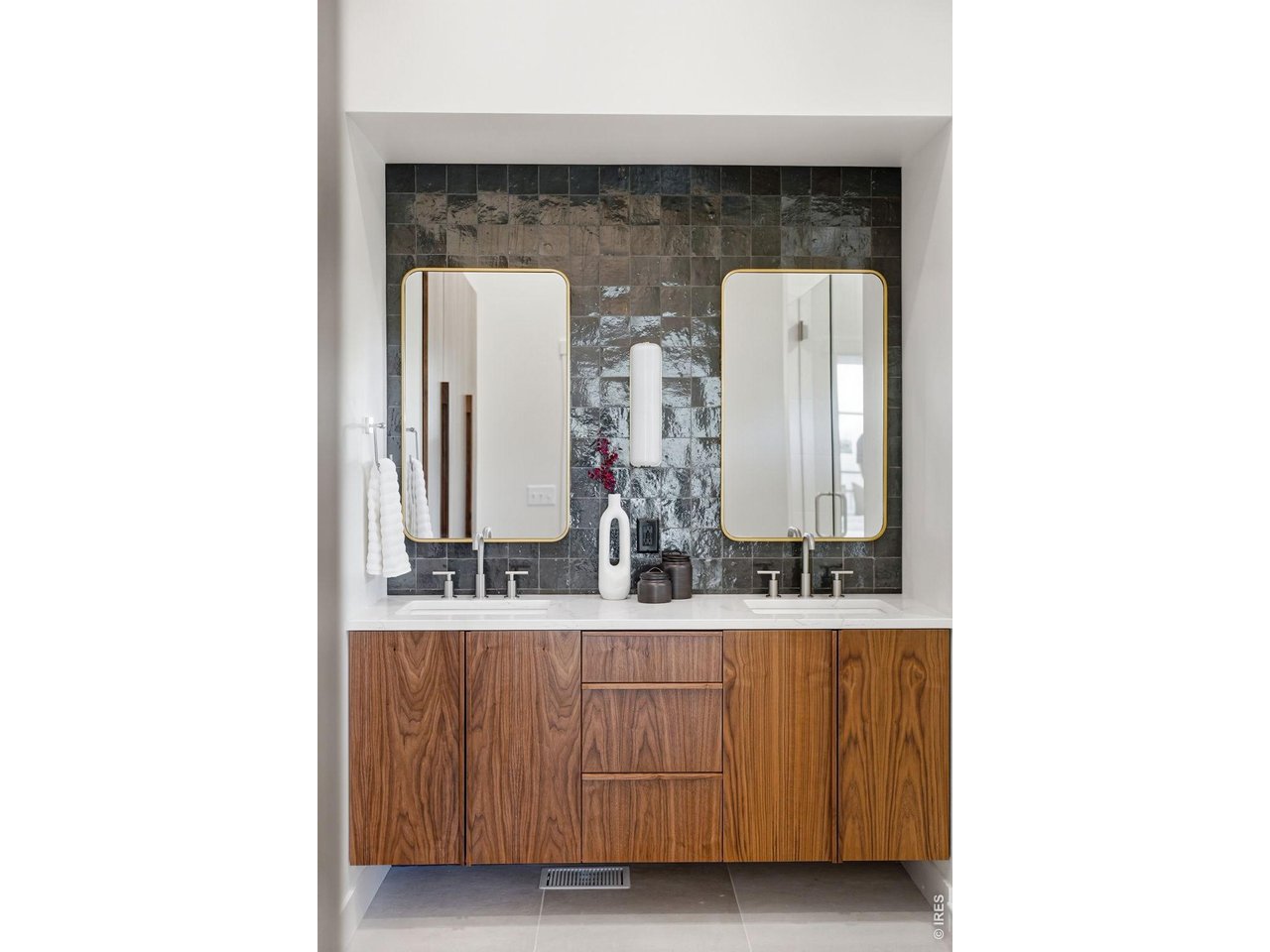 922 Club View Road Fort Collins, CO 80524 - Photo 26 of 50 Consistent walnut cabinetry details-from the kitchen to the wardrobes to the custom vanity-create a timeless, cohesive look. Built-in wardrobes line left wall.
