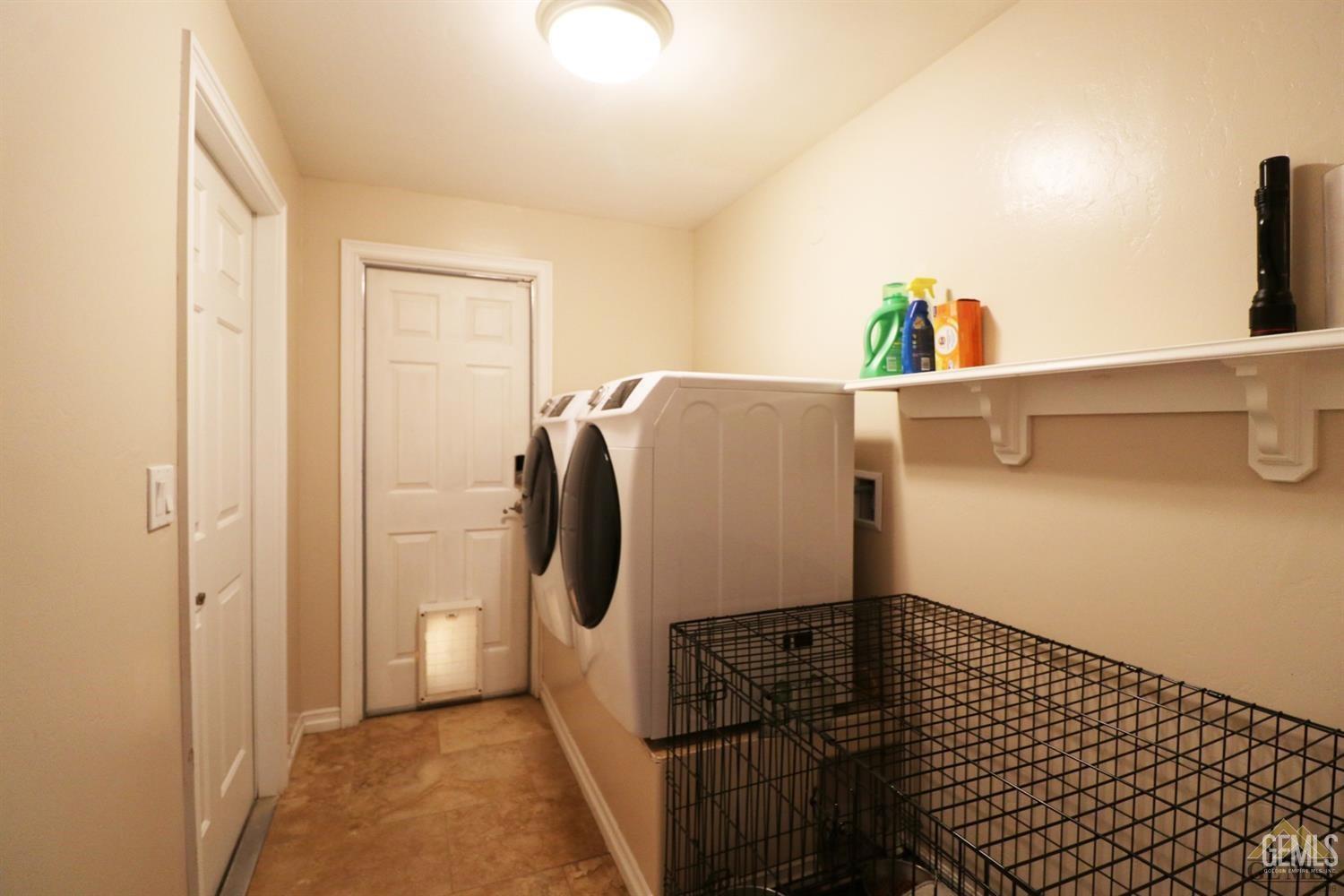 Undisclosed Address Bakersfield, CA 93312 - Photo 20 of 30 a bathroom with a sink and washing machine