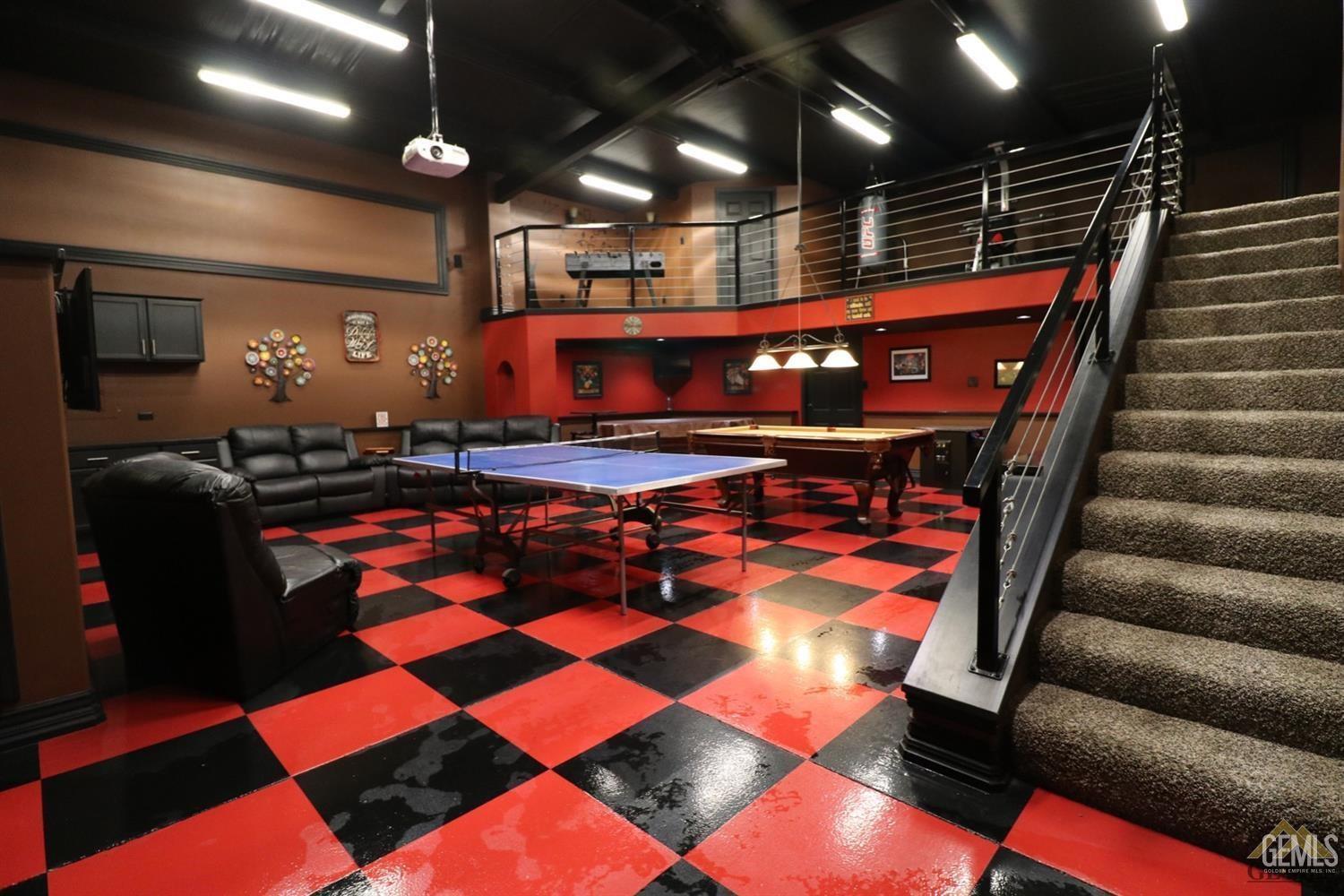 Undisclosed Address Bakersfield, CA 93312 - Photo 3 of 30 a view of a room with gym equipment and wooden floor