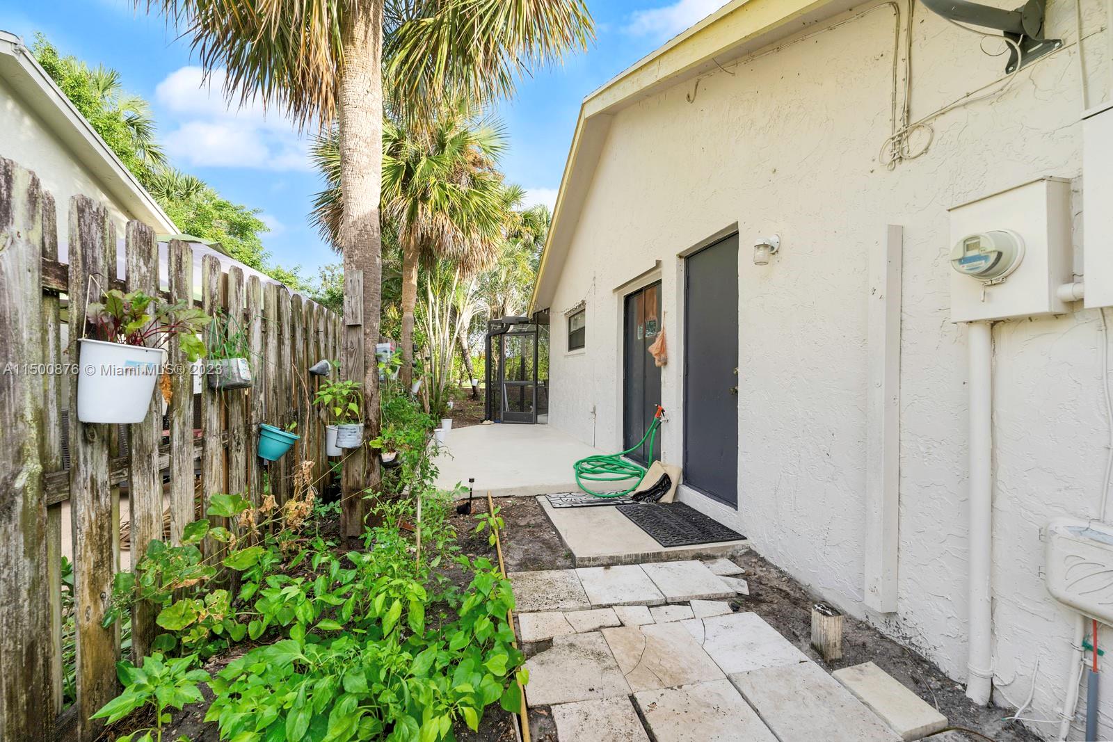 9883 Liberty Court Boca Raton, FL 33434 - Photo 28 of 29 a front view of a house with a yard