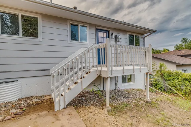 a view of a house with wooden stairs