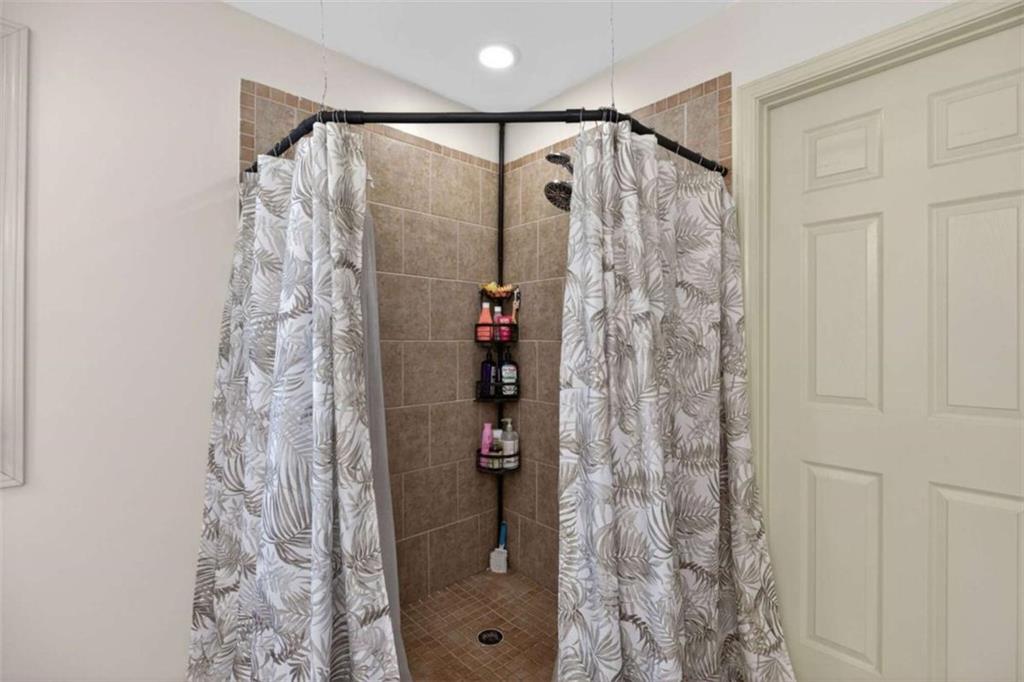 507 Grogan Road Buchanan, GA 30113 - Photo 25 of 31 a bathroom with a shower and a shower curtain