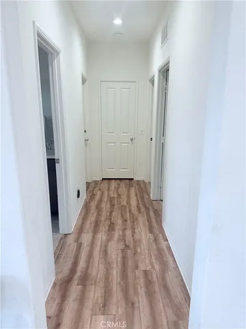 a view of a room with wooden floor and staircase