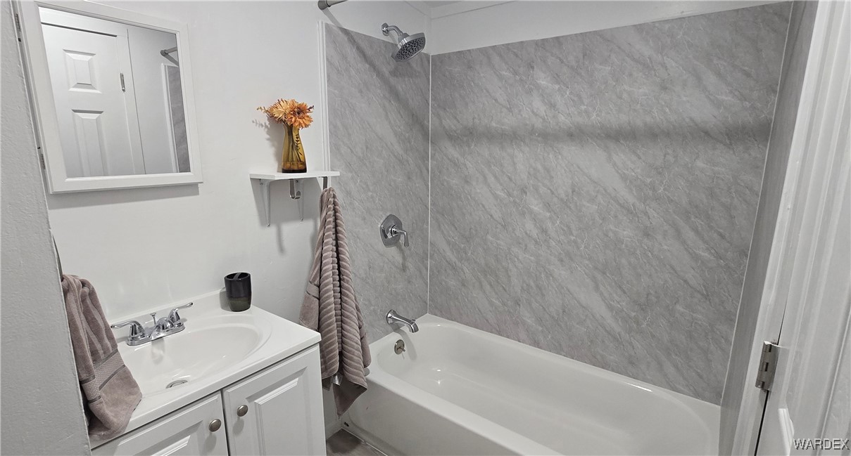3675 Amado Road Golden Valley, AZ 86413 - Photo 13 of 35 a bathroom with a sink and a bathtub