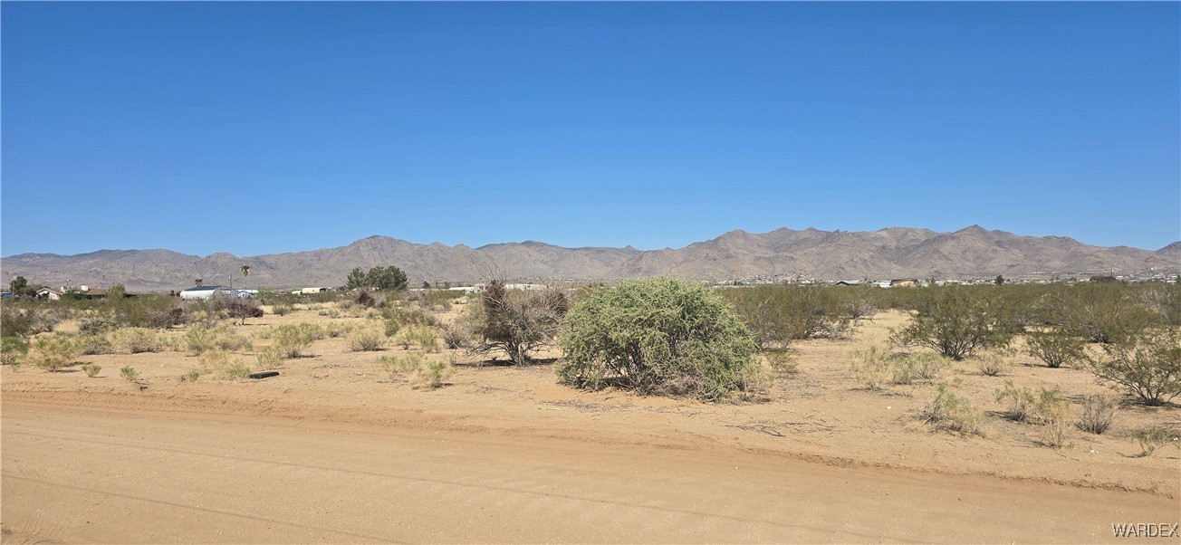 3675 Amado Road Golden Valley, AZ 86413 - Photo 29 of 35 a view of a lake with a mountain