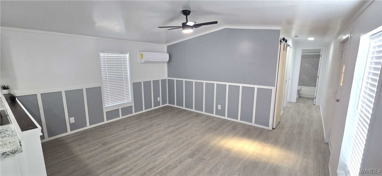 3675 Amado Road Golden Valley, AZ 86413 - Photo 4 of 35 wooden floor in an empty room with a window