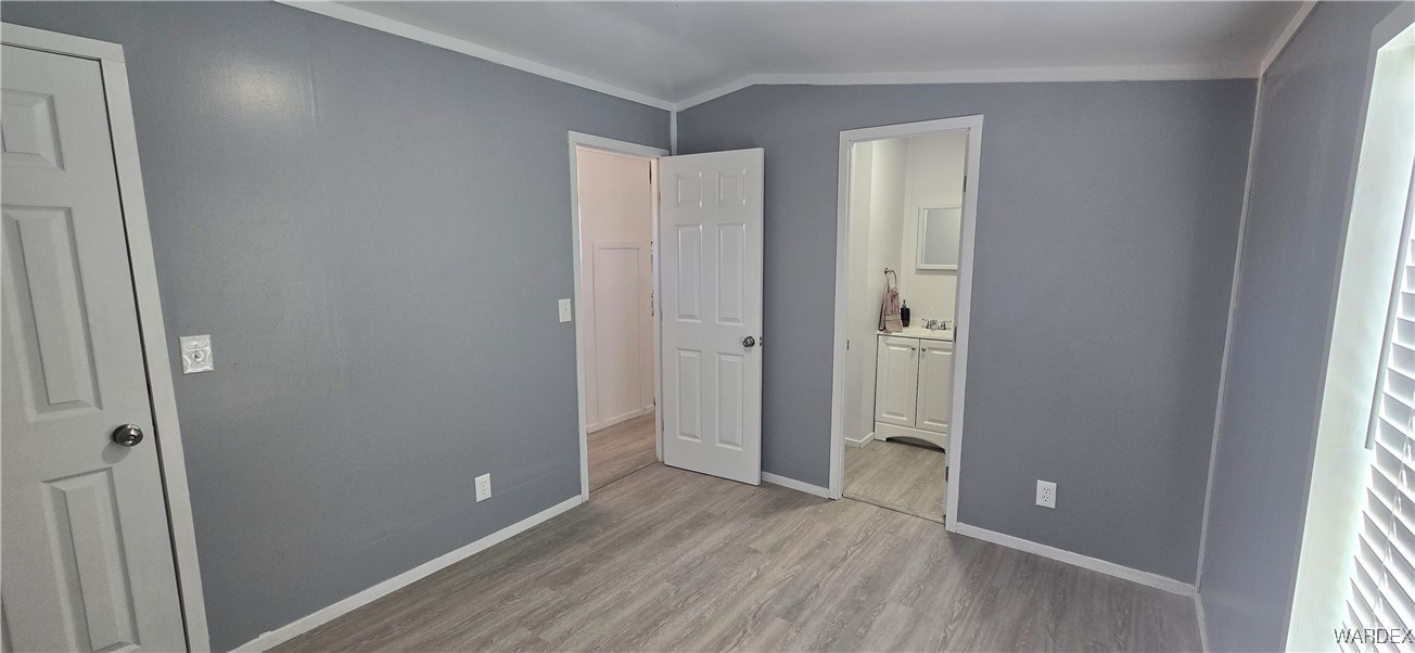 3675 Amado Road Golden Valley, AZ 86413 - Photo 8 of 35 a view of an empty room with closet and a window