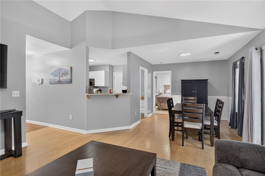 3336 Centerville Road Anderson, SC 29625 - Photo 8 of 50 An open concept living and dining area boasts light wood flooring, creating a fluid and inviting space.