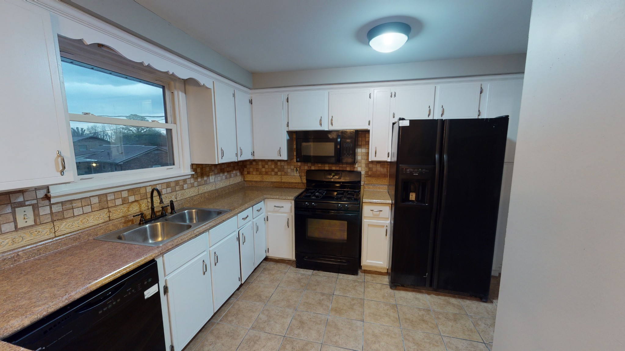 401 Burch Road Clarksville, TN 37042 - Photo 8 of 39 a kitchen with granite countertop a refrigerator and a sink
