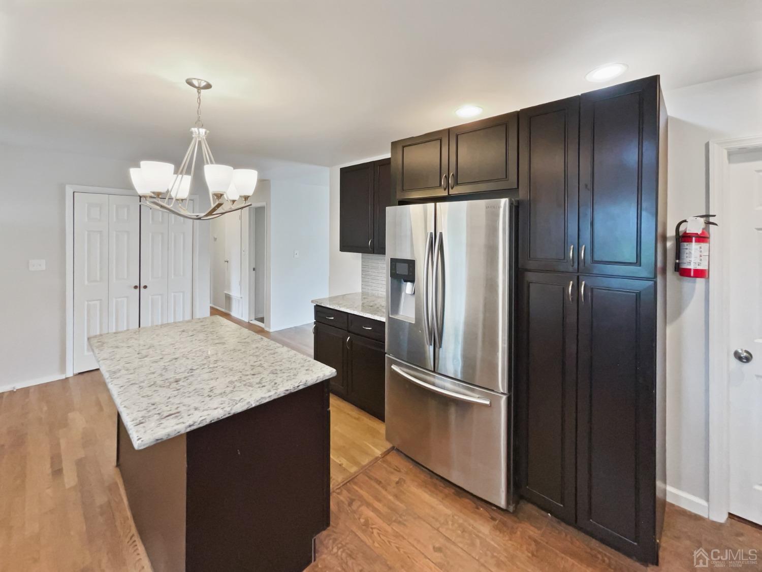 19 Clemson Road Old Bridge, NJ 08859 - Photo 12 of 23 a kitchen with granite countertop a refrigerator and a sink