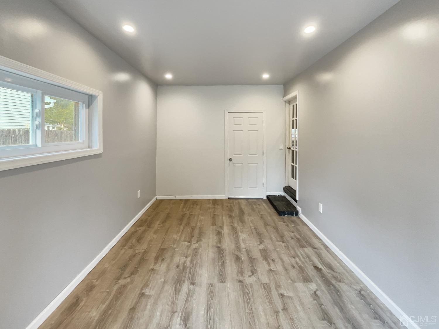19 Clemson Road Old Bridge, NJ 08859 - Photo 13 of 23 a view of empty room with wooden floor and fan