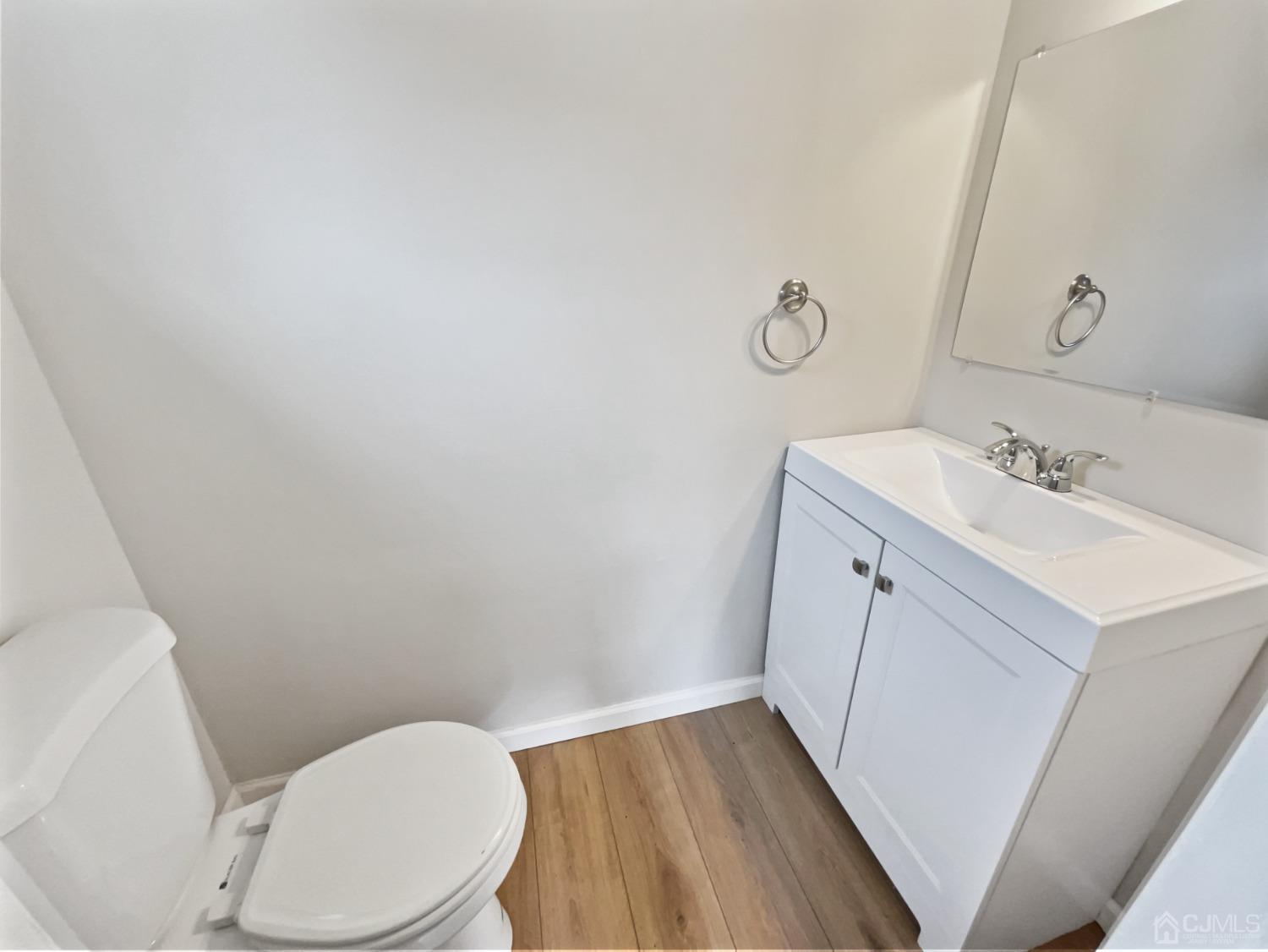 19 Clemson Road Old Bridge, NJ 08859 - Photo 18 of 23 a white toilet sitting next to a bathroom sink