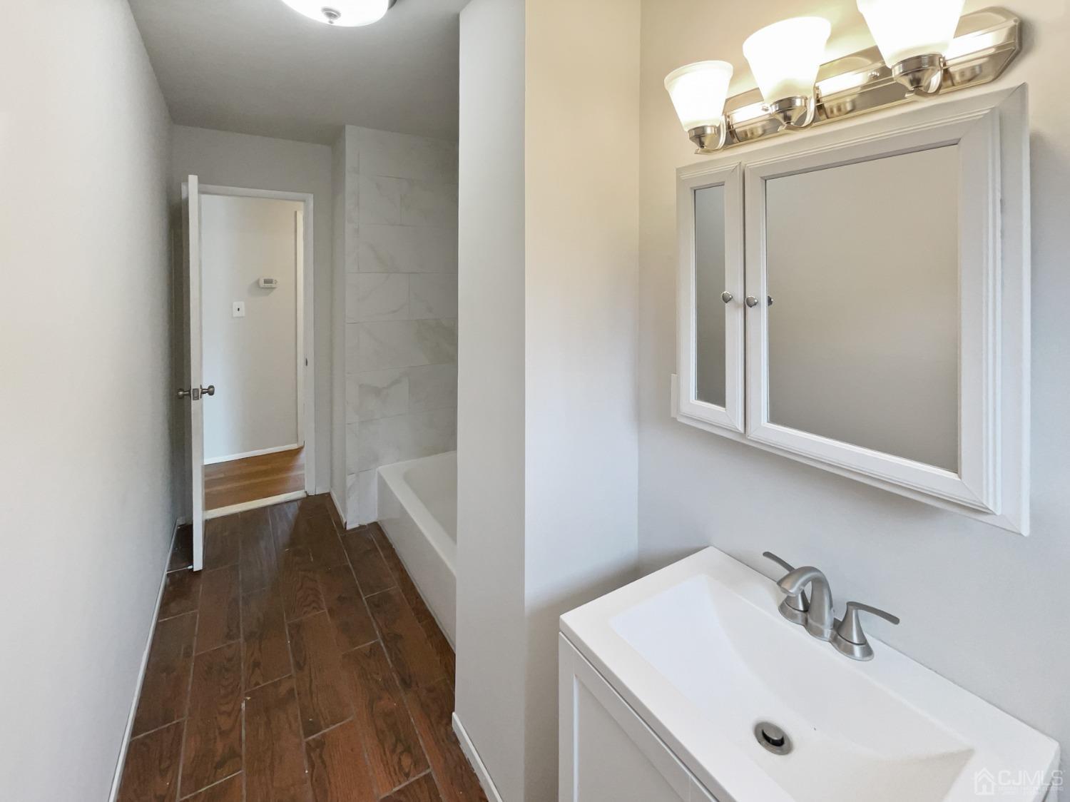 19 Clemson Road Old Bridge, NJ 08859 - Photo 19 of 23 a bathroom with a sink and a mirror