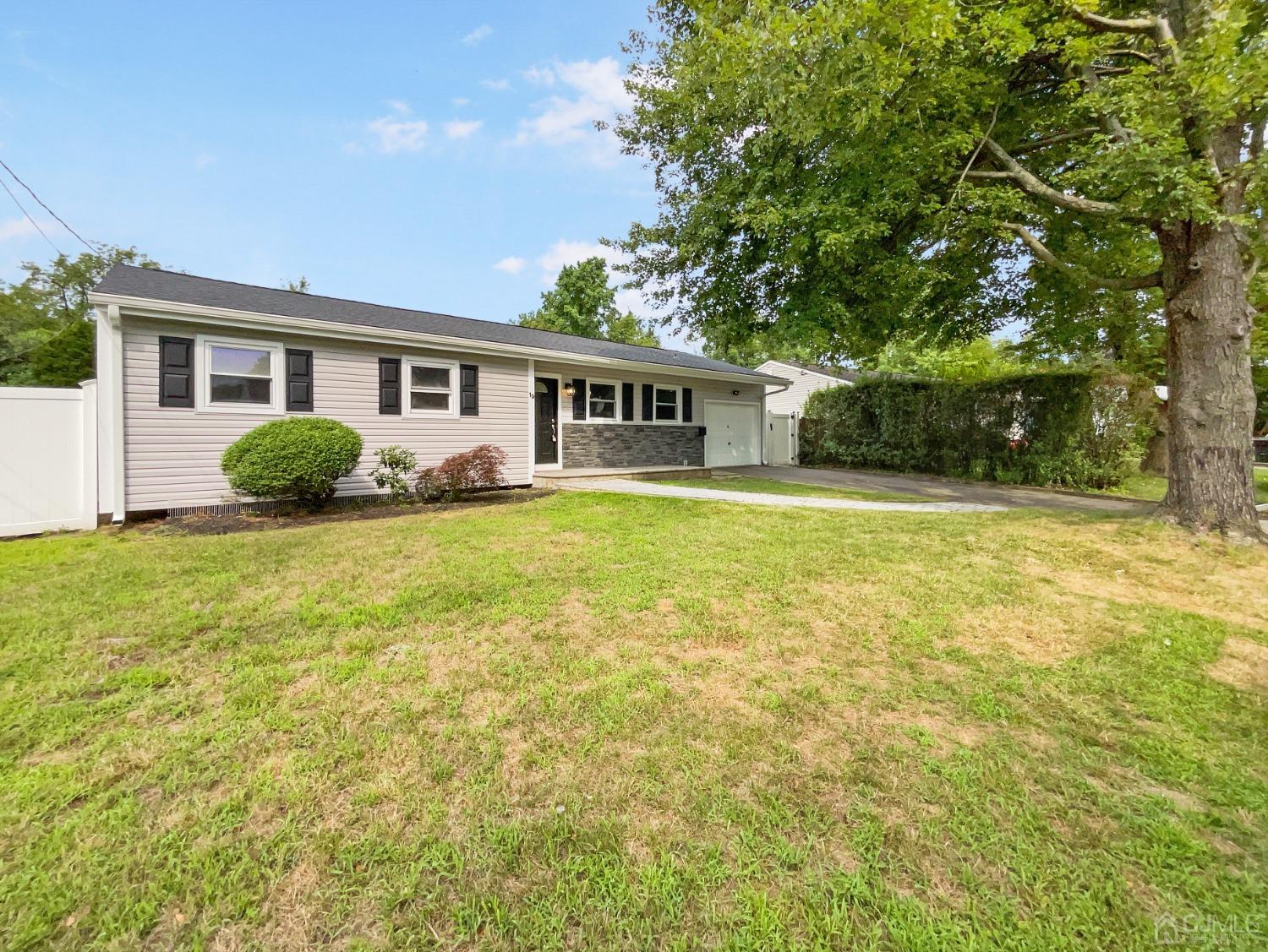 19 Clemson Road Old Bridge, NJ 08859 - Photo 9 of 23 a front view of house with yard and green space