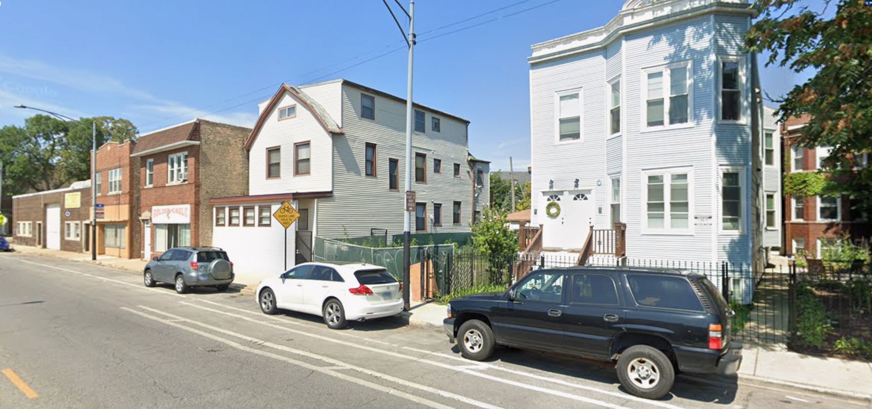 3675 North Elston Avenue Chicago, IL 60618 - Photo 8 of 19 a car parked in front of a house