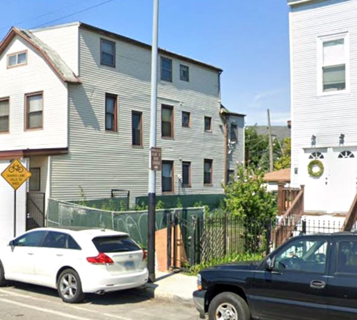 3675 North Elston Avenue Chicago, IL 60618 - Photo 9 of 19 a car parked in front of a house