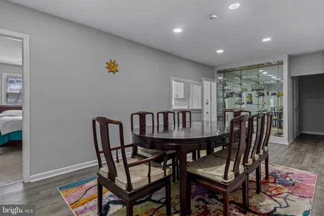 a living room with furniture a rug and a flat screen tv