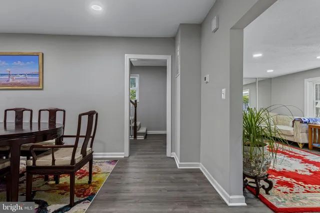 a living room with furniture and a rug