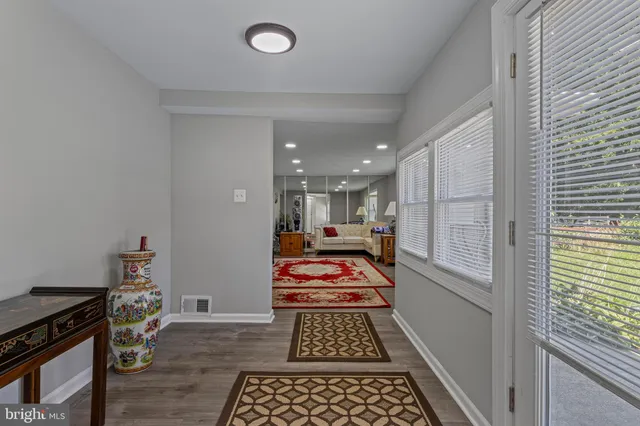 a kitchen with stainless steel appliances granite countertop a sink and a stove