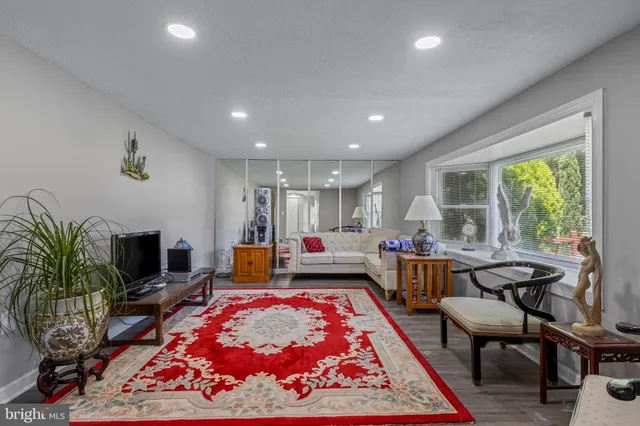 a kitchen with white cabinets and sink