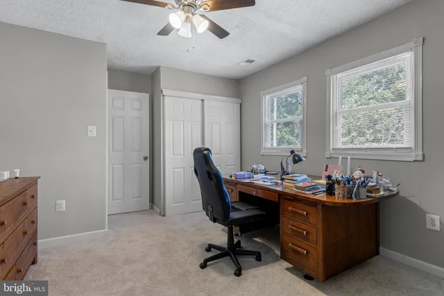 a bathroom with a double vanity sink and mirror with shower