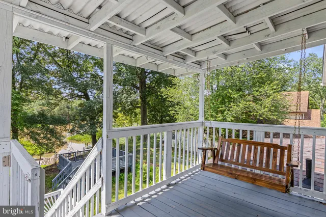 a view of room with window and wooden floor