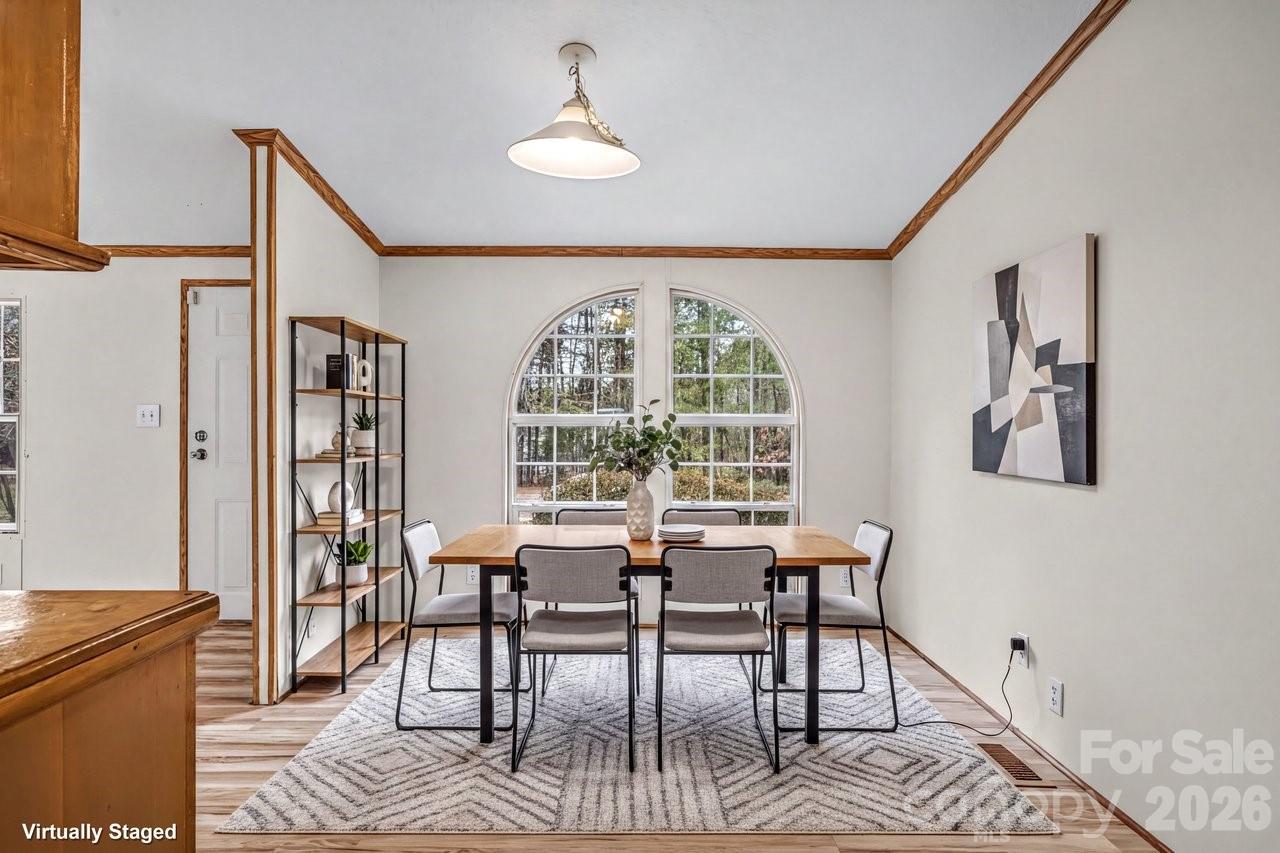 40348 Barnhardt Road New London, NC 28127 - Photo 15 of 38 a view of a dining room with furniture and a window