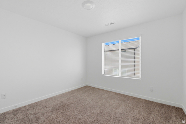 3788 South Galatia Road Magna, UT 84044 - Photo 16 of 24 Neutral wall tones with a rectangular window featuring horizontal blinds
