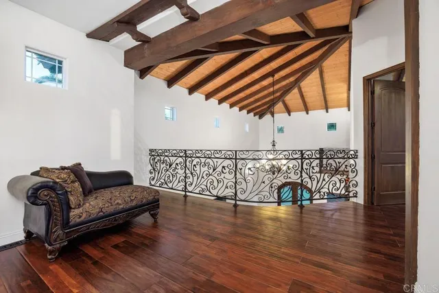 a view of a couches and a rug on a wooden floor