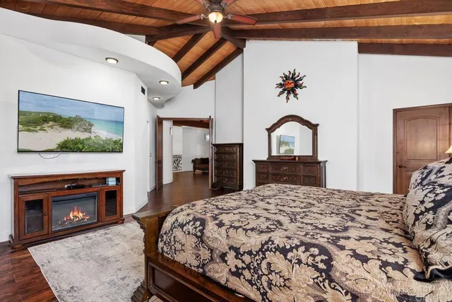 a bedroom with a bed and a fireplace