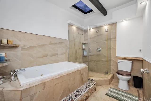 a bathroom with a bathtub and a toilet